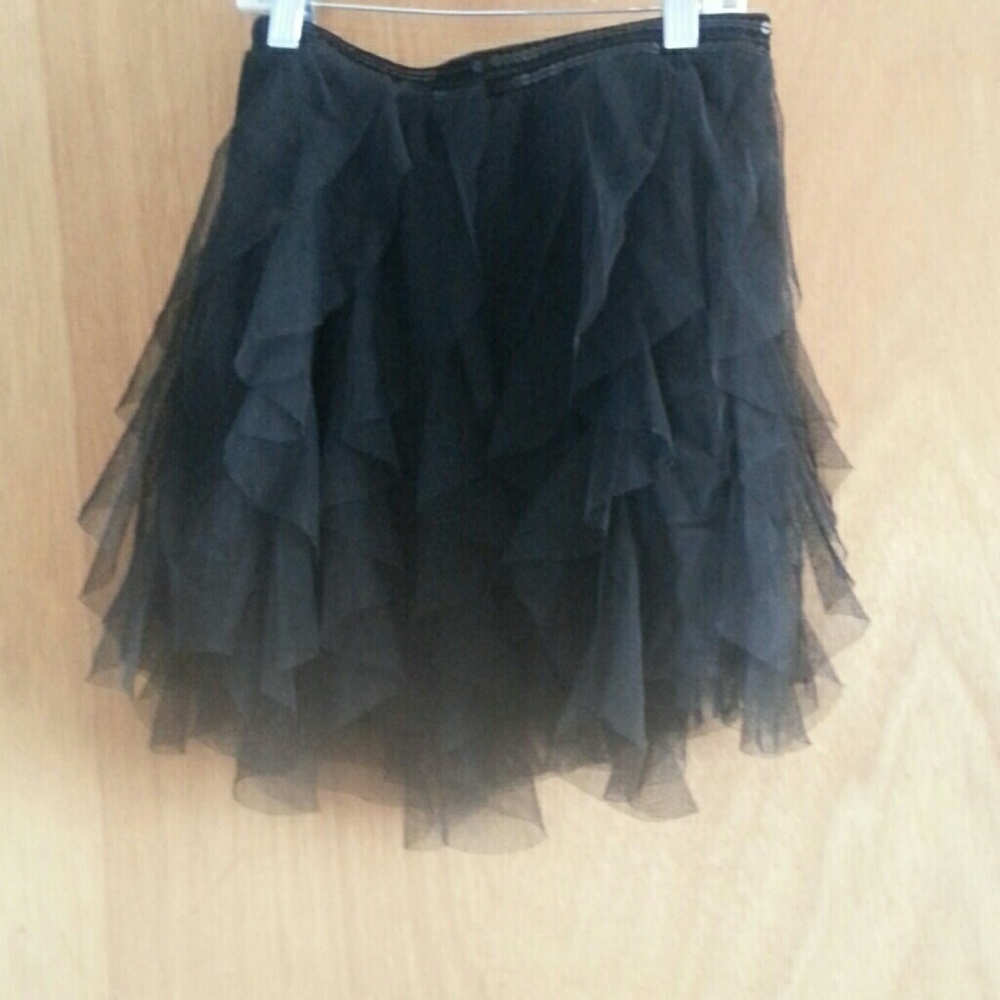 Black ruffle skirt sequence in front